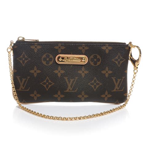 Louis Vuitton Milla Clutch .